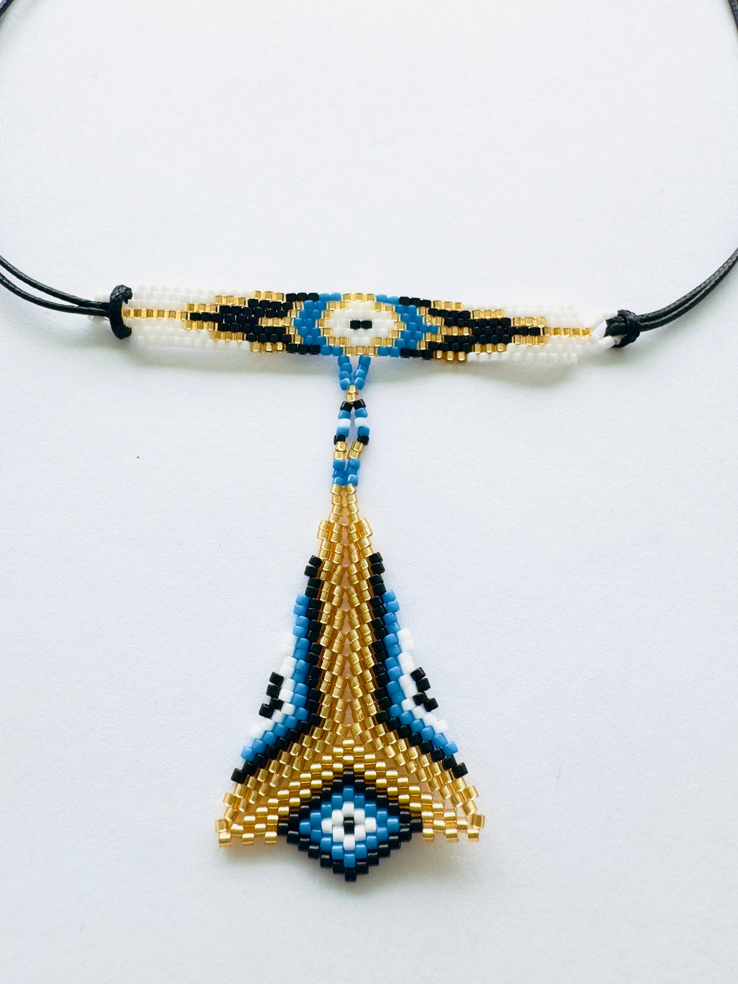 COLLAR OJO DORADO